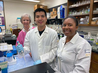 Three people in a lab