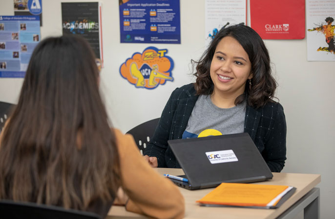 Thalia Rodriguez smiling at a student