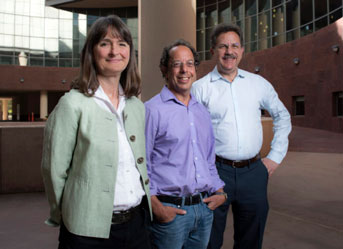 A woman and two men standing together