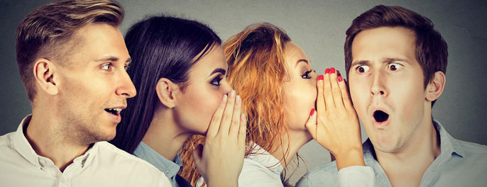 A row of people listening to gossip