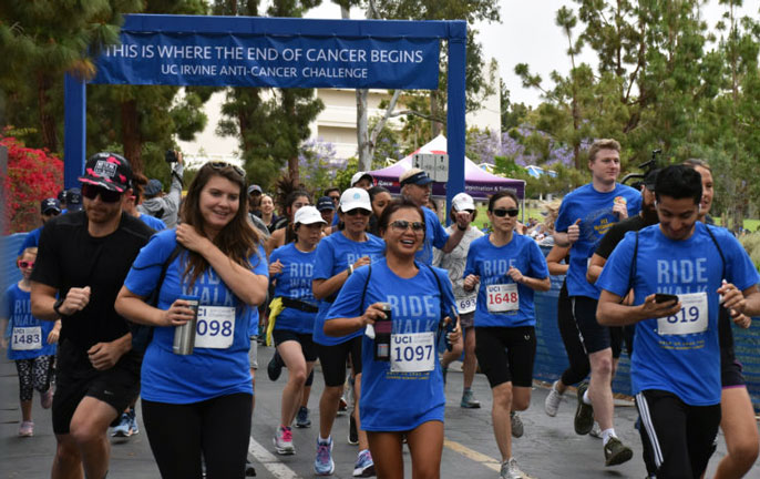 People run and walk as part of the Anti-Cancer Challenge