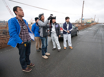 UCLA’s Yoh Kawano (with camera)