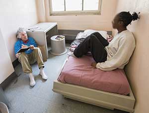 Richard Ross and girl in cell