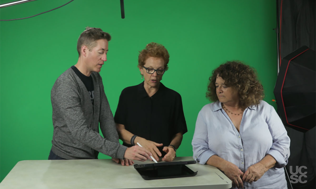 Three instructors in front of green screen