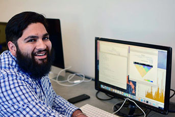 Vicente Ramirez in front of a computer