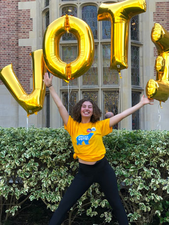 Arden Dressner Levy jumps in front of Vote balloons