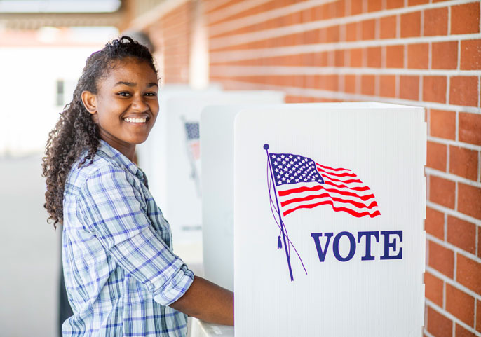 Young black woman at a voting booth