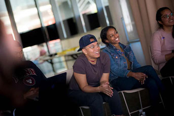 students listening to Carrie Mae Weems