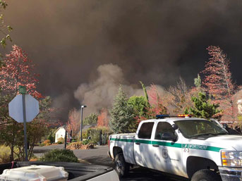 Truck in front of a lot of smoke