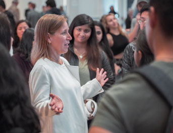 YouTube CEO Susan Wojcicki surrounded by students 