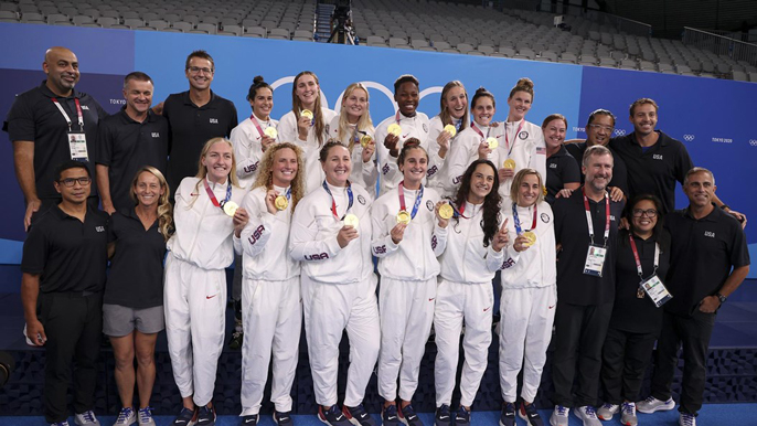The U.S. women's water polo team poses with their gold medals in Tokyo